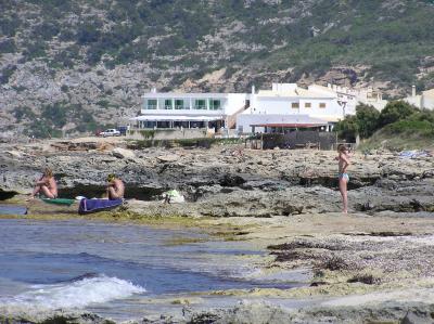 Es Calo Rockpools with the village in the background