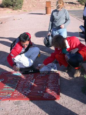 A Navajo artisan offers jewelry for sale