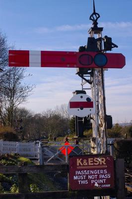 Signal with crossing gates in background