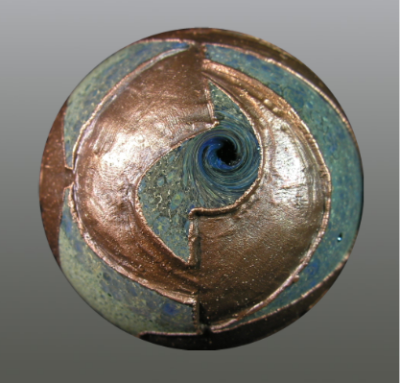 O's were carved (ground) into the surface (giving texture), and then copper electroformed, a 2-day process.