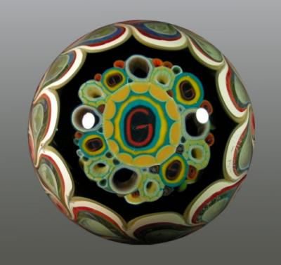 Backside has 'G' milli closer to the surface than the front.