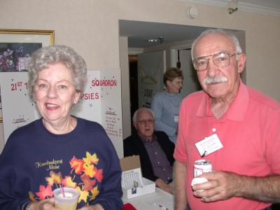 Bernie Pronier  and Marcus Micalakes in the foreground with Buzzy Kreeger sitting and Marlene Grimm standing in the background.