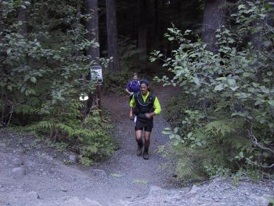 Tony & Marlis emerging from the Skookum Flats Trail - 1/4 mile to the cars to finish