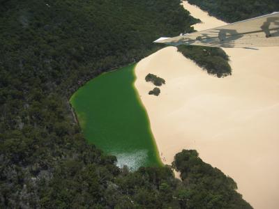 Sand blow engulfing a perched lake, note the people at the bottom of the lake.