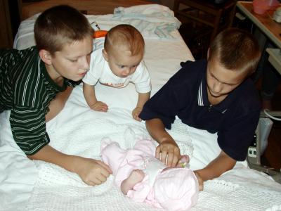 John, Jared, Joshua, First Inspection of Emily Before leaving the hospital.