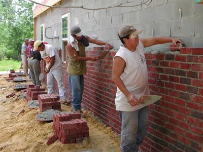 Bricklayers back to work on the outside 06/19/2002