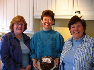 A very decadent birthday cake from 2 of my stitching buddies Betty on the left and Anne Marie wearing the striped shirt