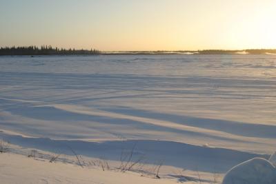 Mist rising in the distance over the Moose River from Moosonee