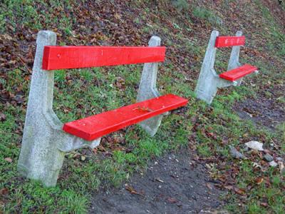 Bright red benches in Gellrt Hill park