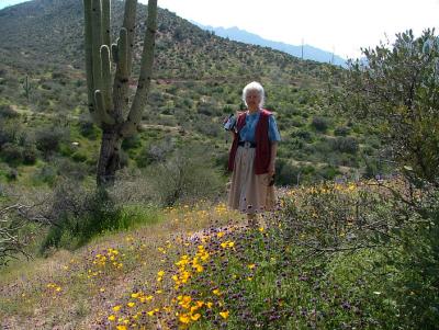 Martha poses with desert wildflowers
