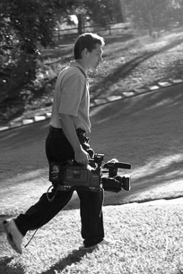 Director carrys camera