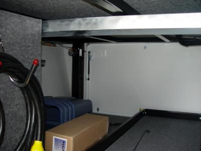 Front Storage Bay With Slide Rack and 50 amp service
