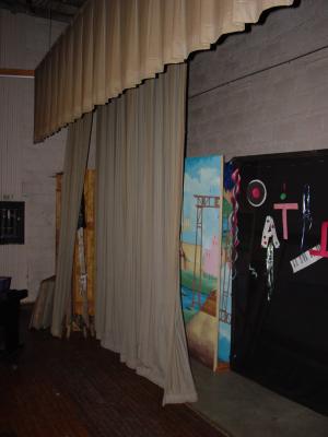 Back stage curtains 11' from front of stage - 6' from back wall - Loading doors behind black flat