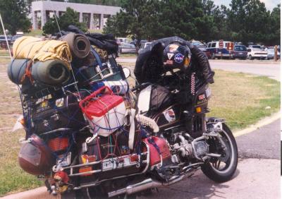 A heavily loaded GoldWing in the Mt Rushmore parking lot about 1995. On a Cincinnati to Seattle ride.