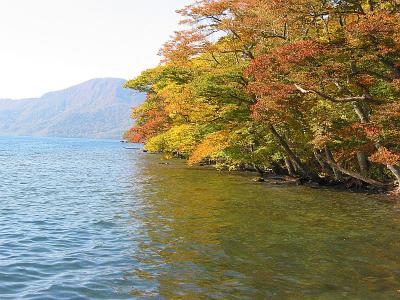 Walking along Towada Lake.  See the mountain in the background