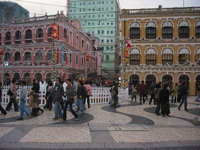 lined with colonial style buildings painted in hues of yellows and pink