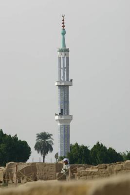 Towards the minaret, beduin worker in front