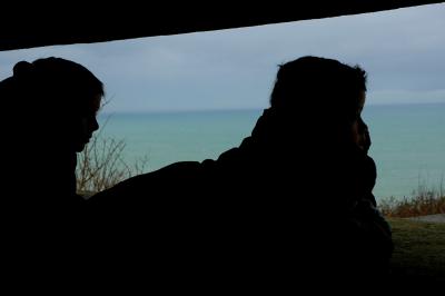 Batterie de Longues command post - two boys look out from within