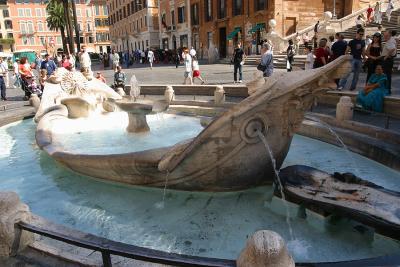 The fountain, Fontana della Barcaccia, at the base of the Spanish Steps in Rome, Italy.