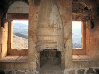 Typical warm looking harem room with fireplace and view.