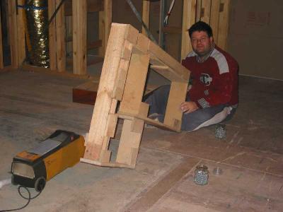 andrew constructs kickboard and laundry cupboard support