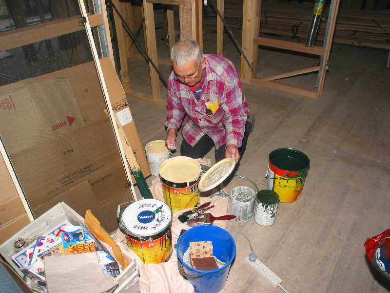 noel helps paint outside