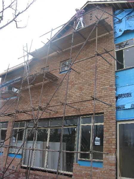 noel on a ladder, on scaffold, painting 9m off the ground