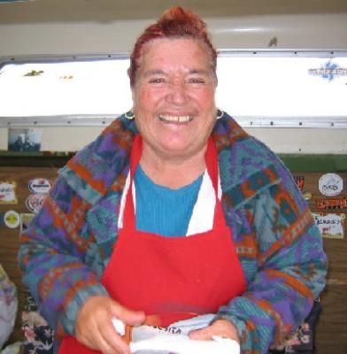 Happy Carmelita with tamale in hand!