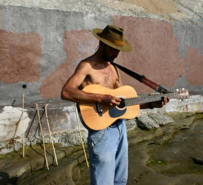  Guitarist Playing To The Ocean