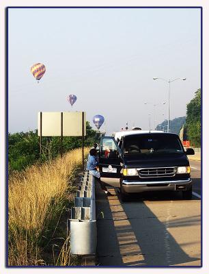 where chase vehicles and teams communicate with the balloonists from the ground and prepare to pick them up at the landing site.