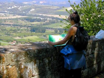 Judy on Viale Carducci in Orvieto with Umbrian countryside in background