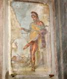 Pompeii - Fresco at entrance to House of Vettii - Priapus weighs his large phallus against bag of money - announces wealth.