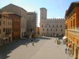 Piazza del Popolo, looking south: Palazzo dei Priori at far end. Built 1280s-1330s. Gothic features. Now it is City Hall.