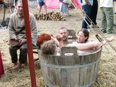 A bathtub full of women and a man