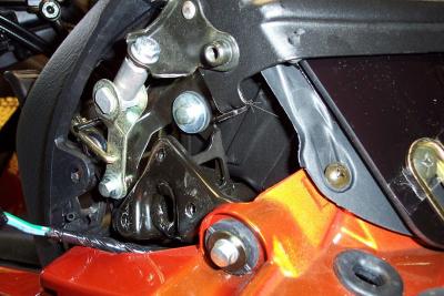 See the position of the tabs.  The fairing tab is BELOW the windshield clamp tab. This is how I found it from the factory.