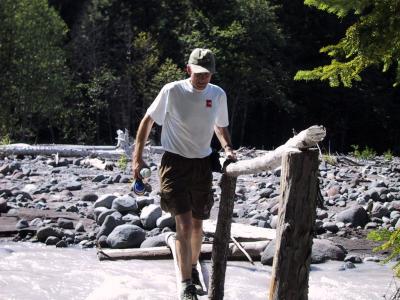 Ron crossing White River - one of many log crossings.