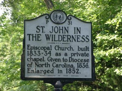 Sign on US 25 noting the history of the church, visible from these garden sites.