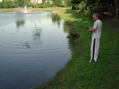Tim hooks a monster in the local fishing hole  7/10/2002