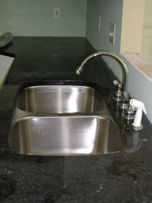 Kitchen sink and faucet ready for action