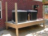 Climate control units rest on a newly constructed deck