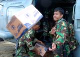 Indonesian Army Commando tosses supplies