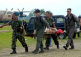 Indonesian Army personnel carry a patient