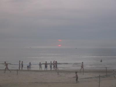 Sunrise at My Khe beach, the Vietnamese are out in force at like 5:30am till 8am or so whence they generally disappear to work I suppose. The AM is quite a scene with lots of soccer circles, playing keep away from each other(which I got to play a few times after they sort of taught me the rules), bathing in the small surf, volleyball and strange violent looking calisthenics. This one looks got enlarged.
