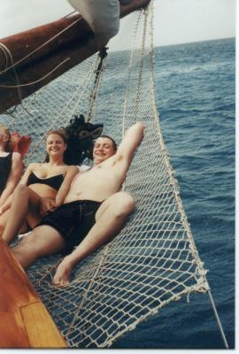 Josh & Elizabeth in net under bowsprit of sailing ship