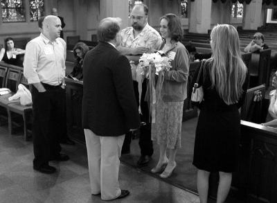 The Pastor (in dark jacket) rehearses with Brad, Louie, and Jessica
