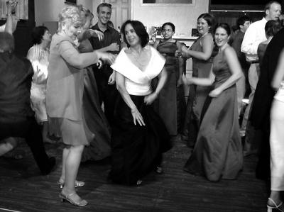 Brad's mom Jean dances with Jessica's mom Maria