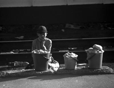 russian boy selling bread at train station