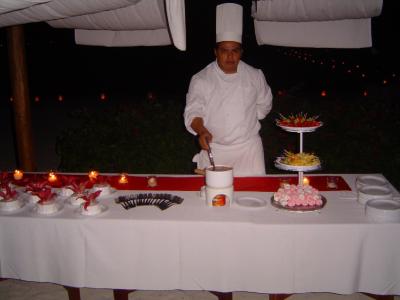 Dessert table with sweetheart cakes and chocolate fondue
