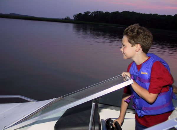 Mike drives the boat (my favorite pic).