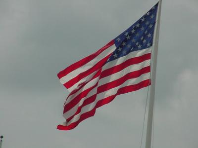 A close-up of the U.S. flag over the fort